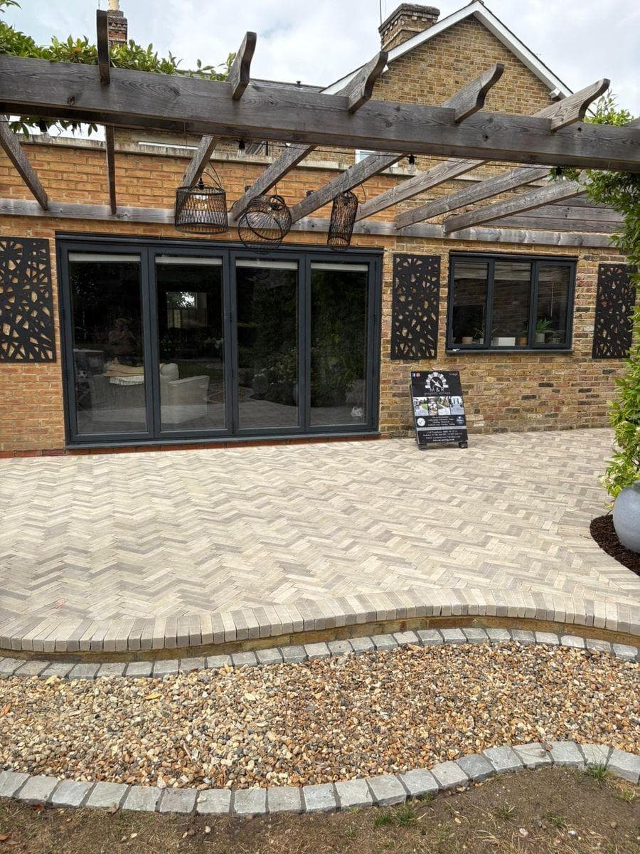 Herringbone block paving patio with gravel border